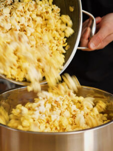Movie Theater Popcorn Recipe going into bowl