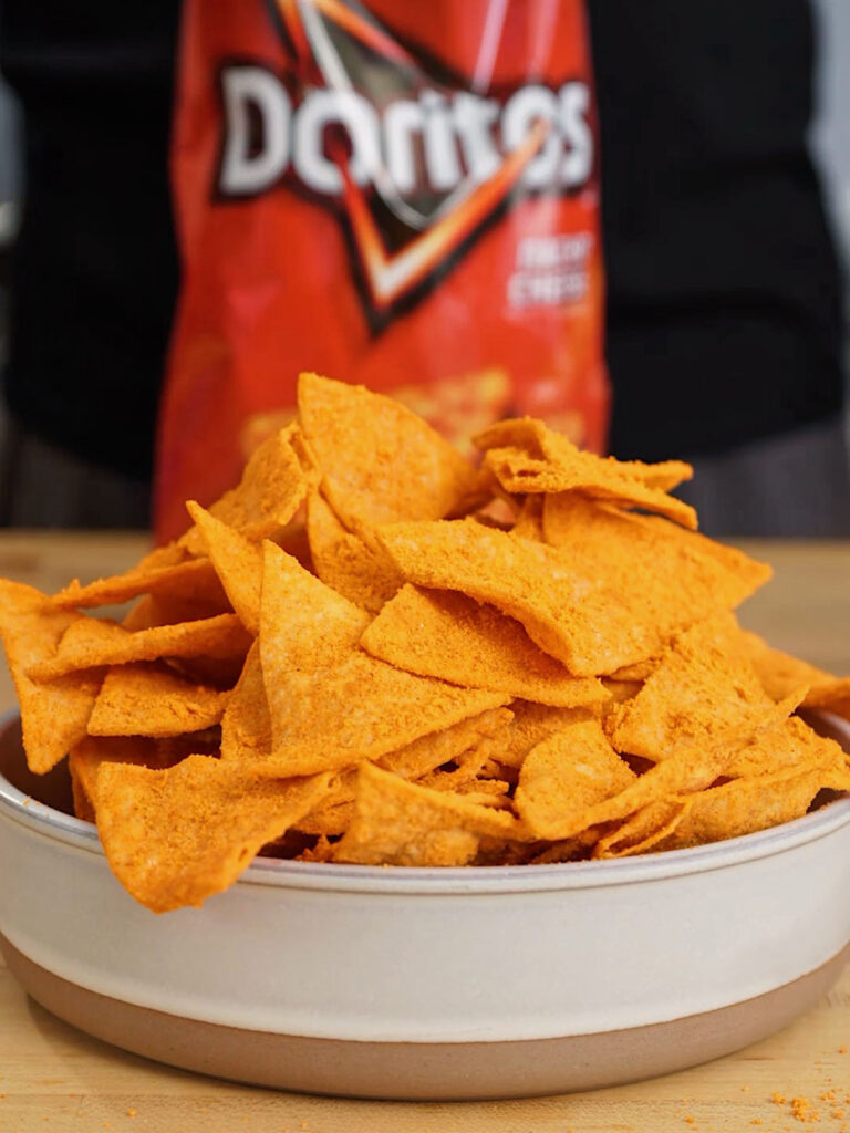 Finished homemade Nacho Cheese Doritos, expertly coated with Roice Bethel's precise food science-engineered seasoning blend from @noflakeysalt. Homemade Doritos Recipe