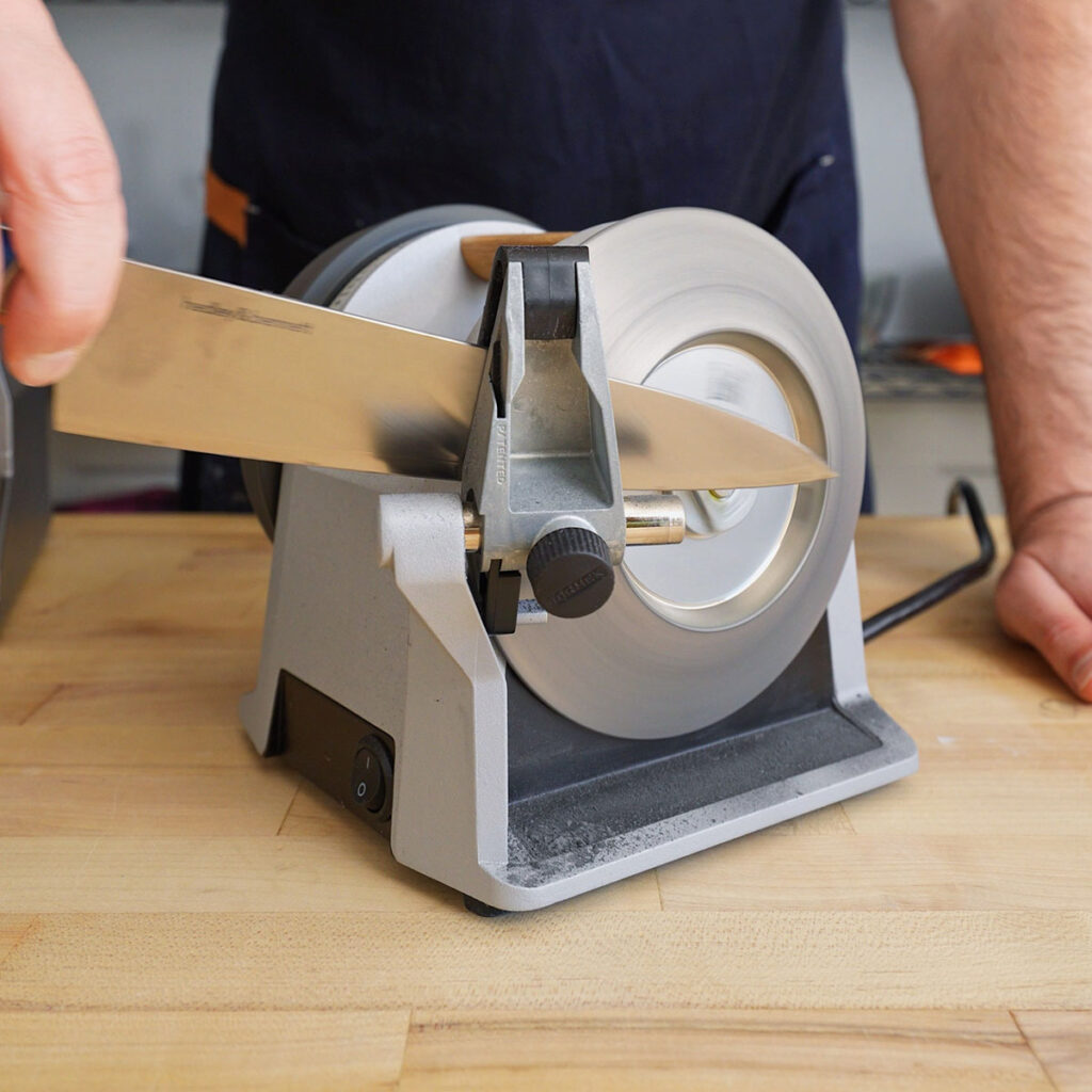 Sharpening a knife on a Tormek T-1 motorized kitchen knife sharpener