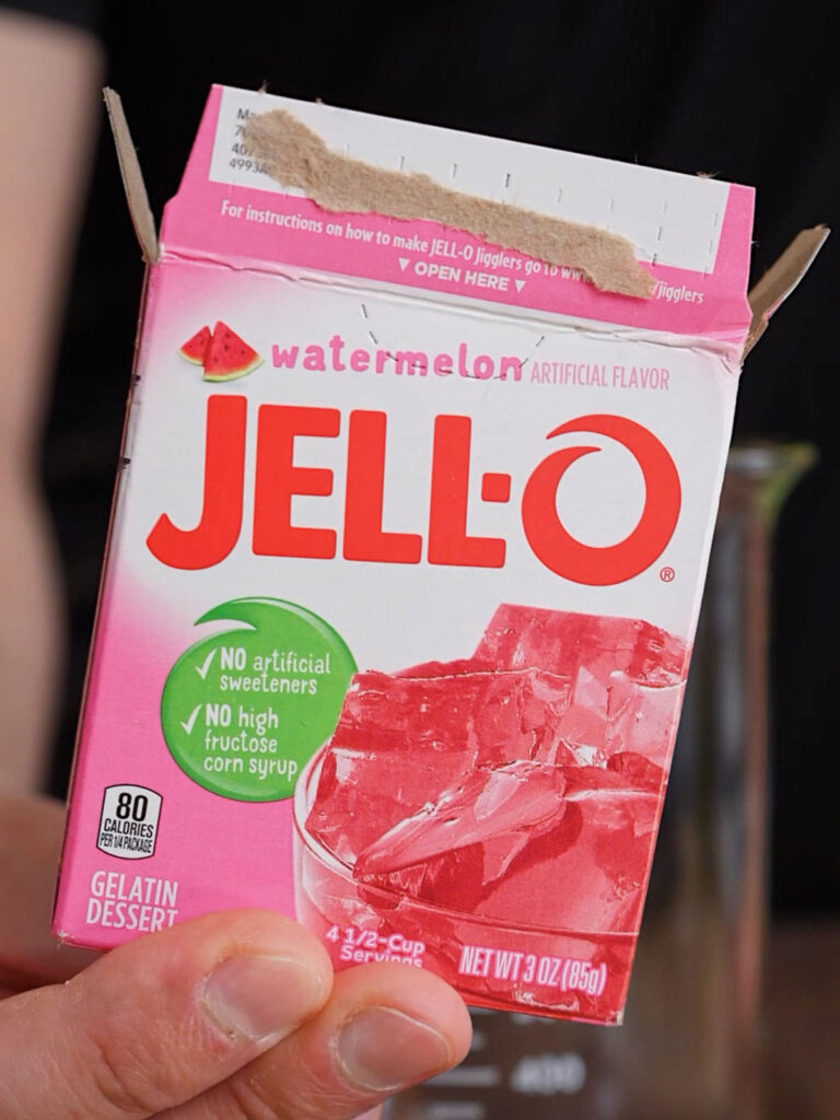 A close-up of a Watermelon Jell-O box, the primary flavor ingredient used to make an easy 3-ingredient sour patch candy recipe.